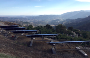 Ground-mounted solar panels installed on a mountain slope