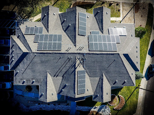 Overhead view of rooftop with attached solar panels.