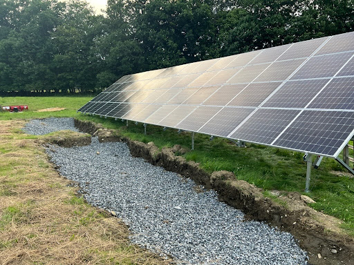 Ground-mounted solar panel system installed in an open field using the Osprey PowerRACK® system by Nuance Energy.