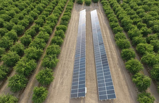 Image shows two solar panel setups: a pole mount and a standard ground mount